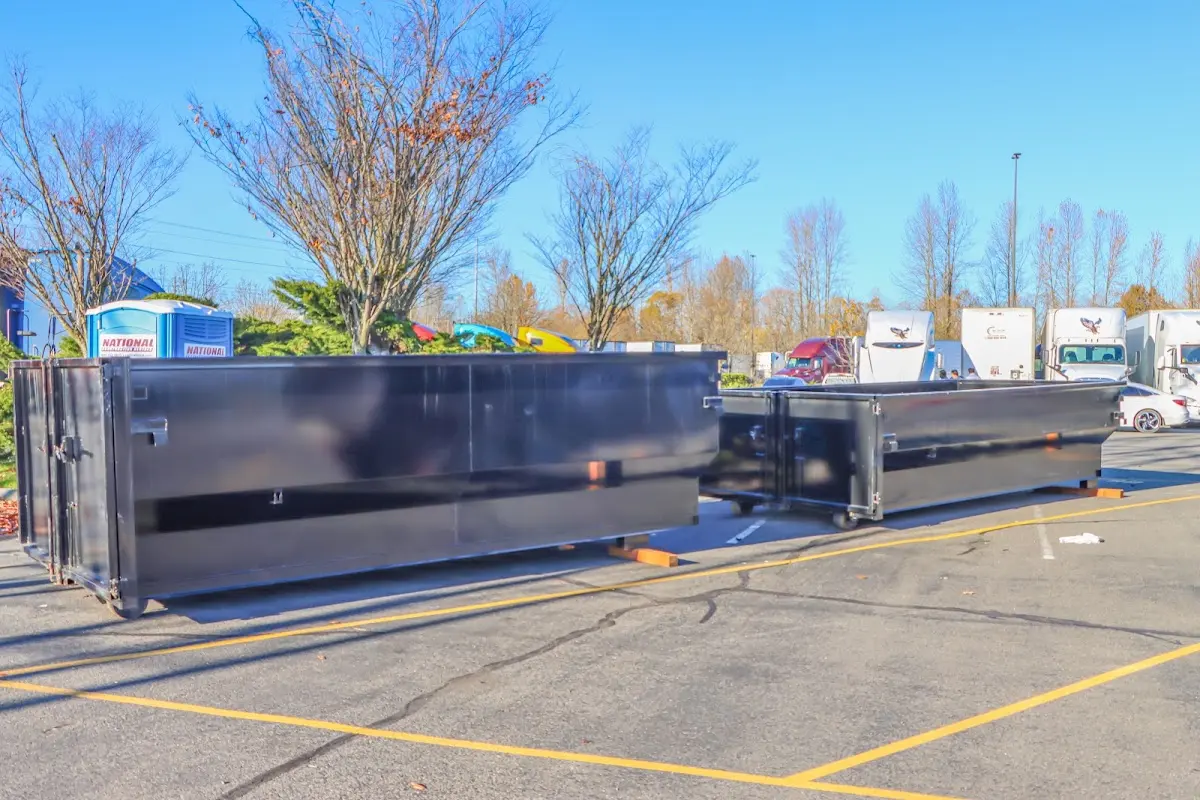 Professional dumpster rental service with roll-off container on residential driveway in North Bethesda